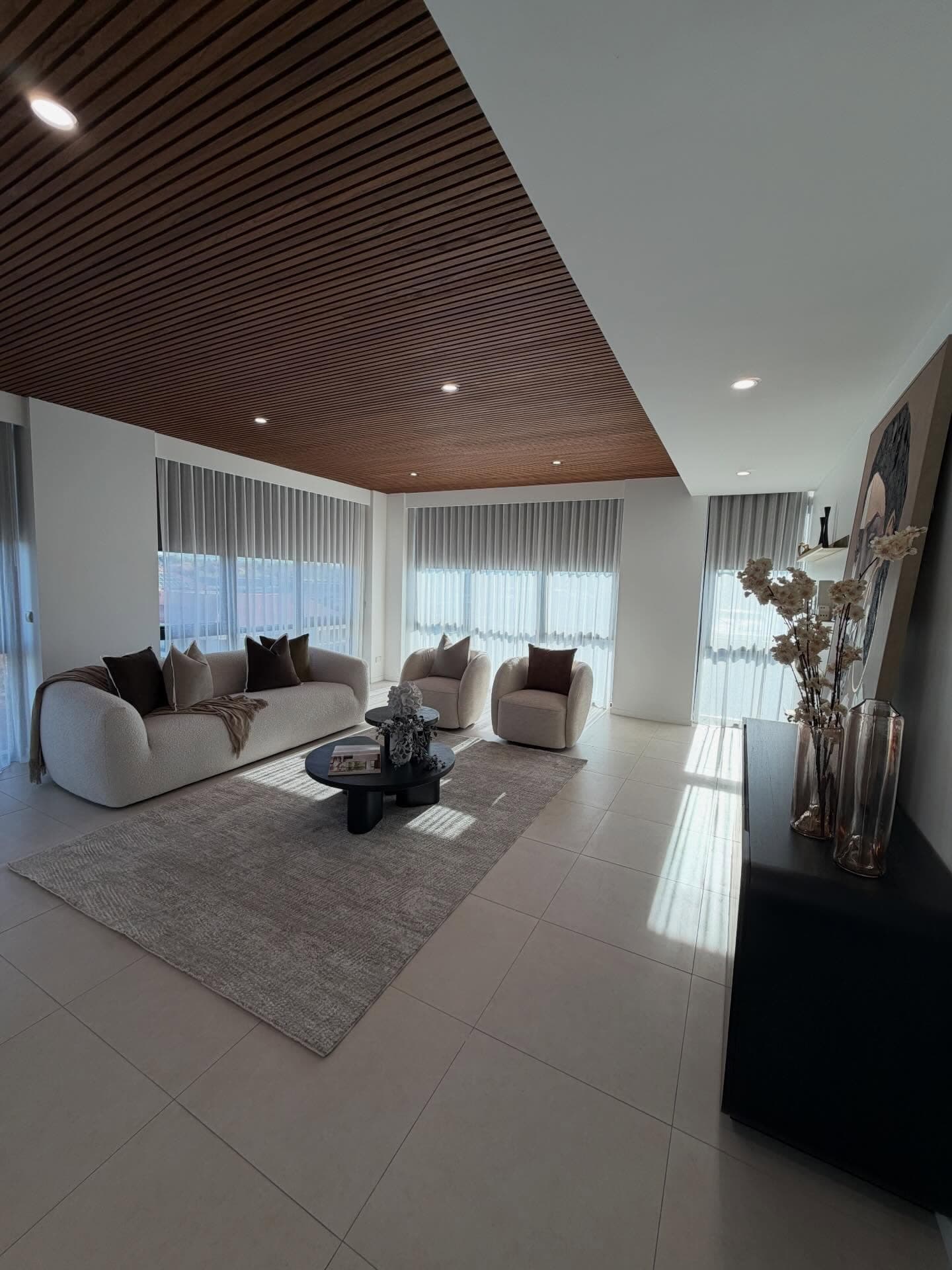 Styled On Point staged living room with layered soft furnishings